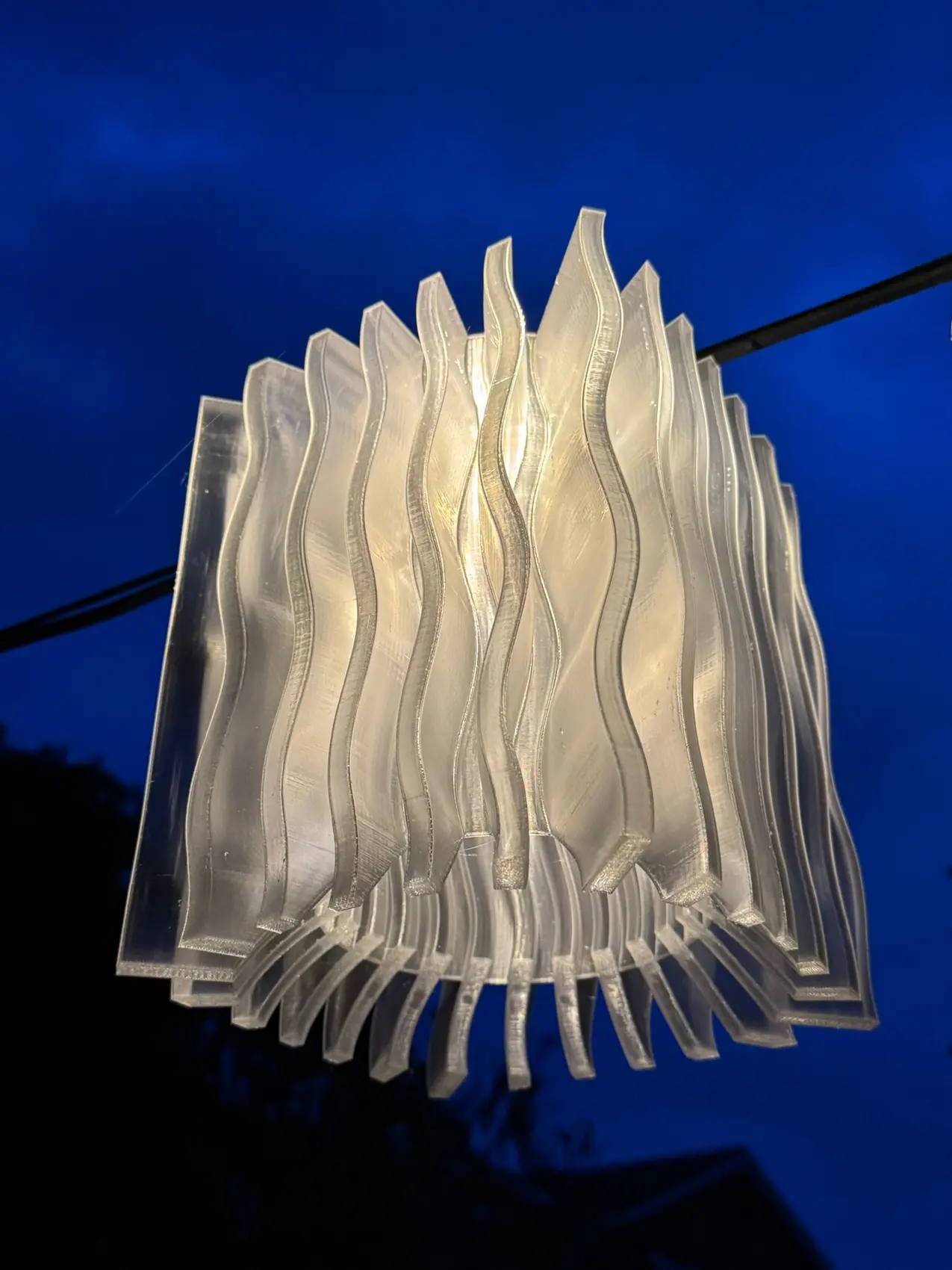 A translucent additive-manufactured lighting shade